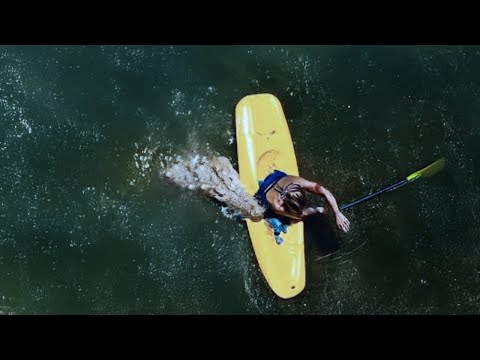 This Woman Was Rammed Off Her Canoe & Death Rolled by a Massive Croc