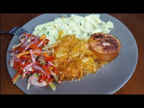 Sausage "steaks" with stewed onions and potatoes.