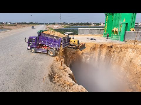 The project has started!! Using a Dozer D-31-A _5T, loading stones and pouring soil into the wall