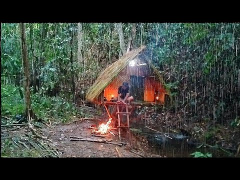 Building a hanging hut out of thatch, drenched in heavy rain all day solo camping bushcraft