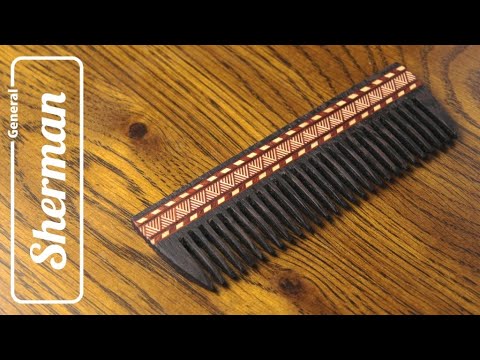 Wooden comb with inlay