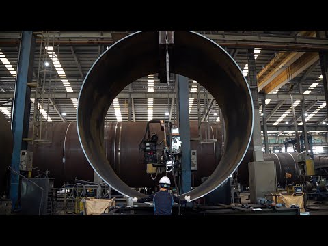 Eco-friendly energy! The process of producing and installing the poles for a giant wind turbine.