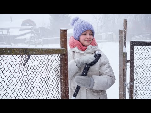 A cozy snowy day in the village of a young family