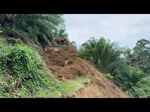 CAT D6R XL Bulldozer Repairs Massive Landslide After Severe Floods