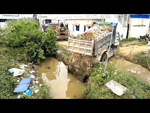 Completed Project Pushing Rock to the flood and grass in water by Bulldozer and Trucks work