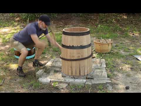 Constructing a beer barrel with hand tools.