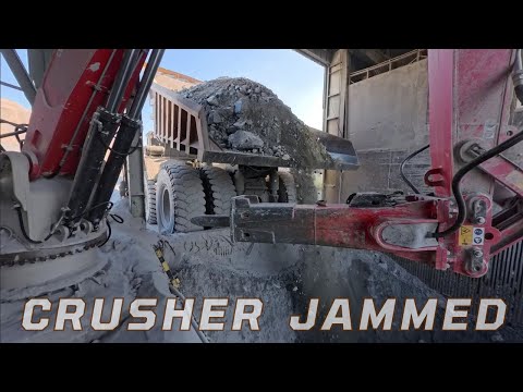 Robotic Hydraulic Arm Breaking Large Chunks of Rock Jammed in the Crusher