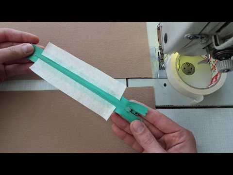 You will thank me for the rest of your life.  Place the sticker tape on the zipper