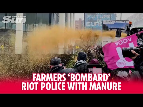 Protesting farmers 'bombard' riot police with manure as they clash in Brussels