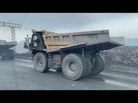 Mining Dump Trucks Working at Full Capacity – Heavy Equipment in Action