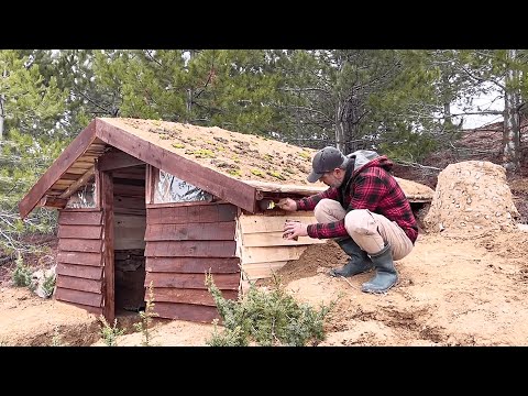 Bushcraft Survival. Two Days to Build a House Made of Wooden Boards and Coated with a Glossy Paint