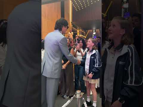 Leaping behind the Wuthering Heights press line, Jacob Elordi posed for a selfie with fans.