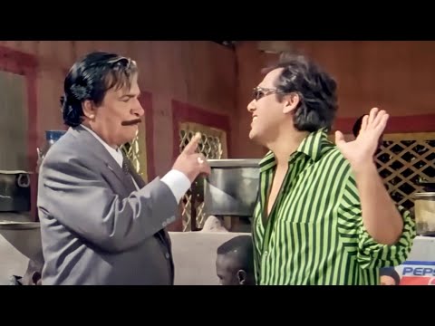 गोविंदा कादर ख़ान का जूता अपनी होटल पर लटका देता है।