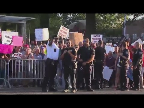 Hundreds of Queens residents stage boisterous migrant center protest
