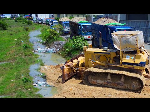 Start the first new project! Komatsu D58E bulldozer pushing soil, Landfill using dump 5ton truck