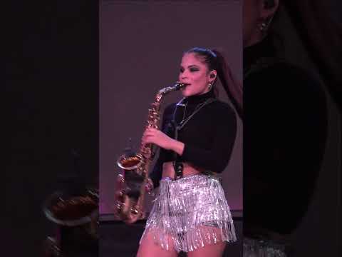 Pretty Saxophone Girl Playing Sax