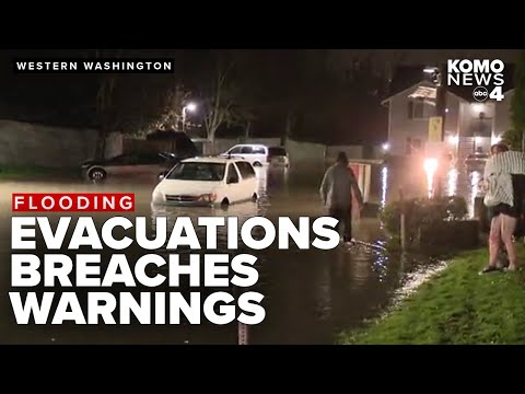 Flash flood warnings, levee failures, and evacuations continue