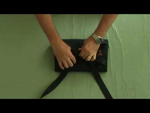 Folding a hakama with a musubi knot