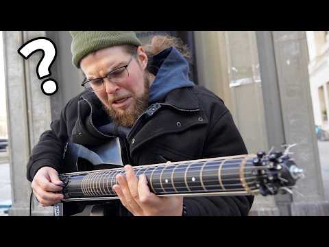 Street musician can't believe the guitar I just handed him