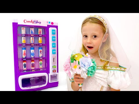 Nastya y papá fingen jugar con la máquina de dulces