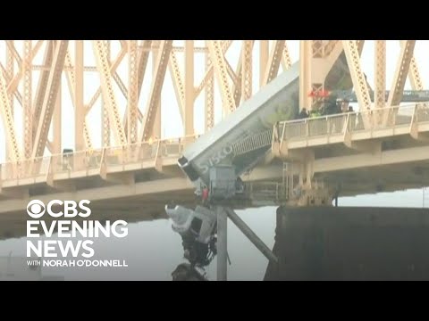 Driver rescued after wreck leaves big-rig dangling off Louisville bridge