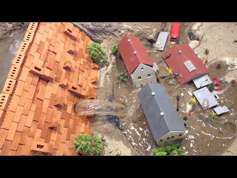Emergency Water Discharge And Mini Brick Model Dam Failure Near Town - Diorama Dam Breach