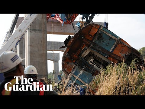 Smoke billows from passenger train after crane collapse killed at least 22 people