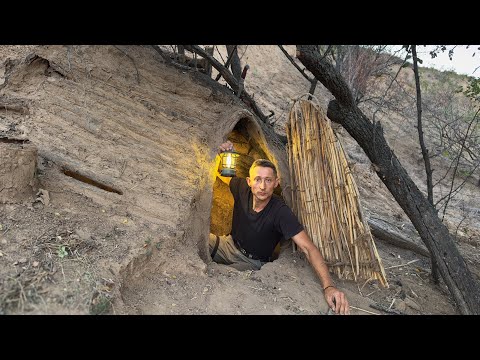 Spending the night in a dugout for survival. Clay stove, cooking. Bushcraft