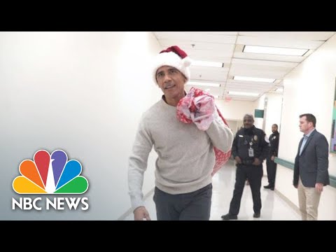 Barack Obama Delivers Holiday Gifts Wearing Santa Hat At Children’s Hospital | NBC News