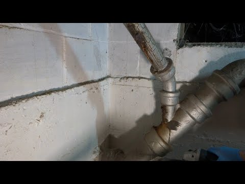 OLD LEAKING CAST IRON DRAIN PIPE REPLACED