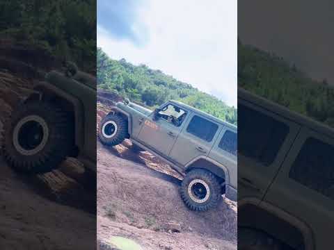 Expert driving SUV 212 climbing super steep mountain terrain