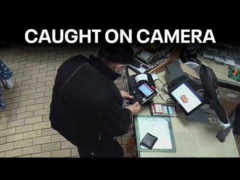 Man caught on camera placing skimmer device on card reader