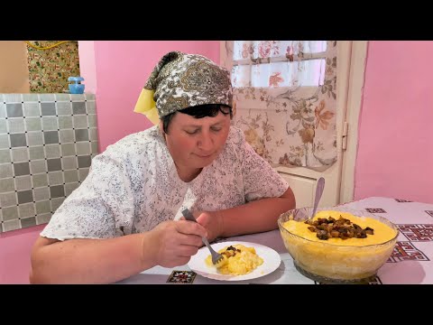 Woman lives alone on the top of a mountain. Cooking a traditional Carpathian dinner