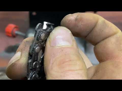 Sharpening a chainsaw chain with a machine.
