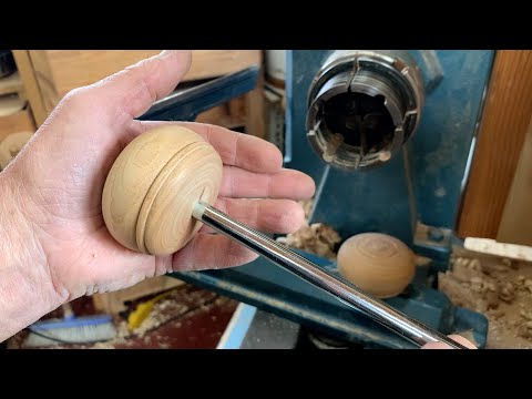 Richard Raffan turns a knob for a knockout bar.