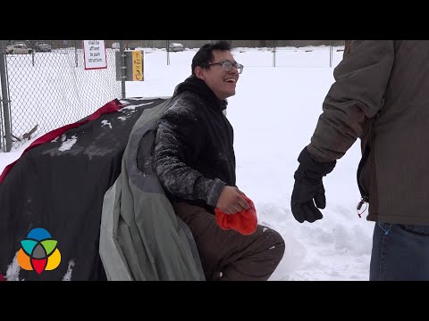 Homeless man sleeps out in the snow at -18°C