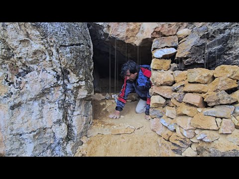 primitive shelter:Building a stone dogout in a rainstorm, thunderstorm, and fog