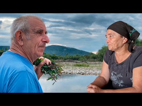 Life of a family in a mountain village. Baking bread and traditional borscht