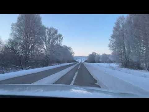POV Driving Through a Winter Landscape