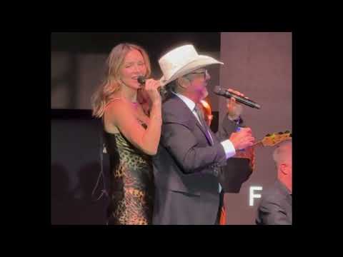 Kat McPhee sings "You Look Like You Love Me" with audience member