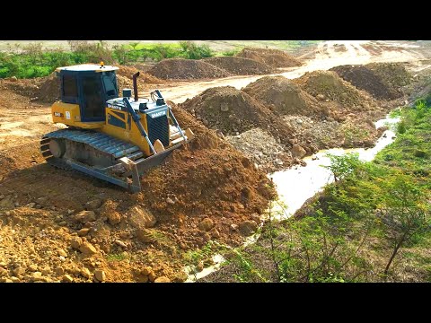 Mighty Heavy Bulldozer Work Moving Earth Filling Lowland Area Dump Trucks Dumping Soil