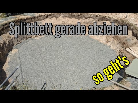 Leveling the gravel bed for terrace, pool construction or garden shed; leveling the gravel from p...