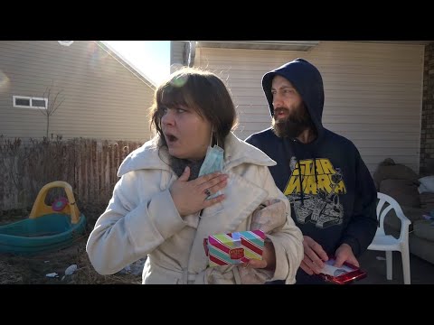 Woman nearly collapses when surprised with gifts from a Secret Santa