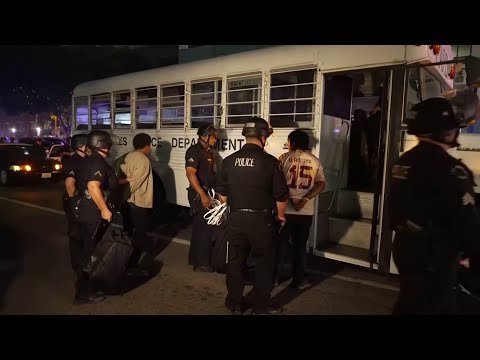 Detained protesters loaded onto a bus in Los Angeles