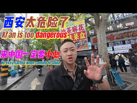 In Xi'an: On the left, the bustle of the morning market; on the right, the millennia-old city walls.