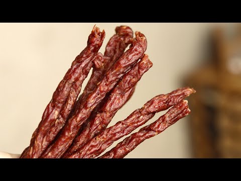 Homemade garlic sausages (beer sausages), in a vegetable and fruit dryer. There is no tastier sna...