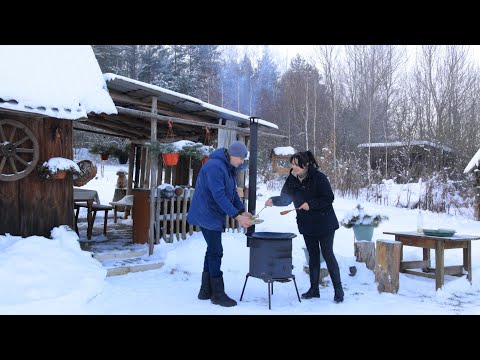 A Snowy day in the Village. A couple's rural life in winter. Cleaning and cooking outside