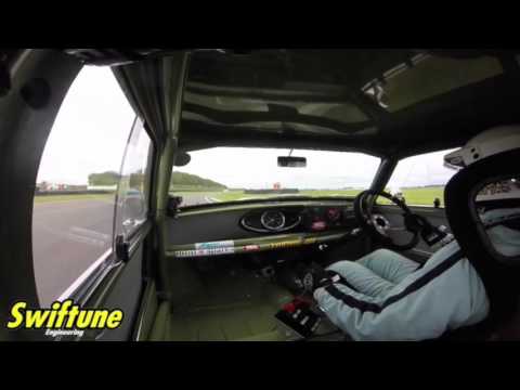 Goodwood Revival Nick Swift's Mini battles Alfa Romeo St Marys Trophy 2015