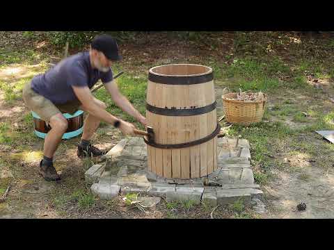Coopering a 36 gallon beer barrel with hand tools.