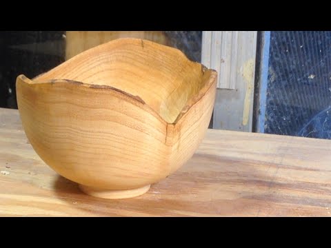 Richard Raffan turns a natural edge bowl in claret ash.